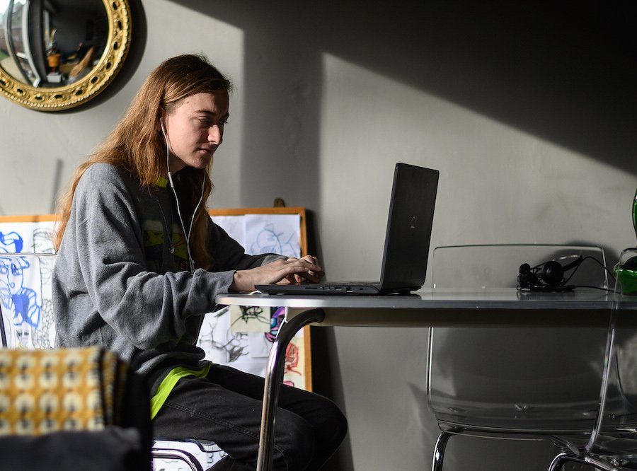 Boy typing on a laptop
