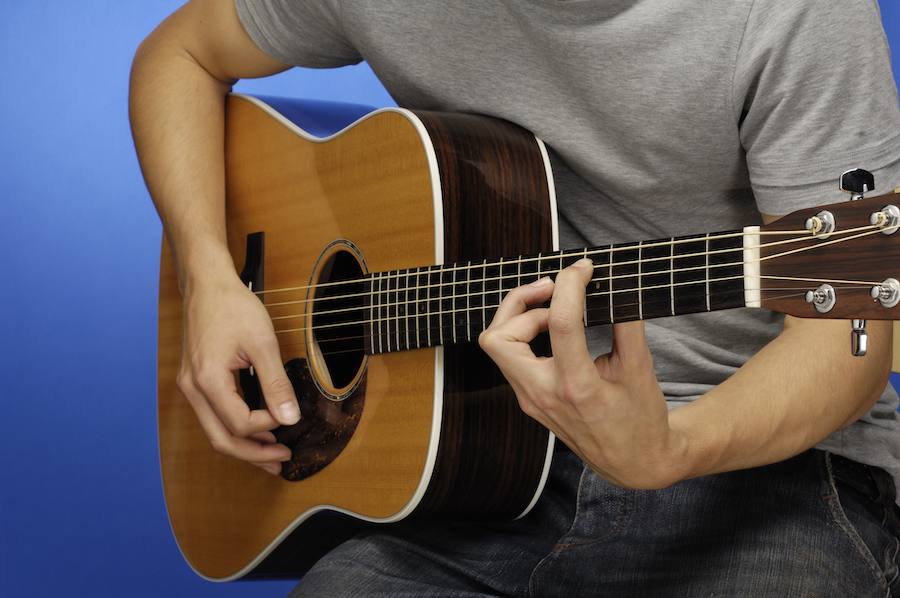 Man playing acoustic guitar