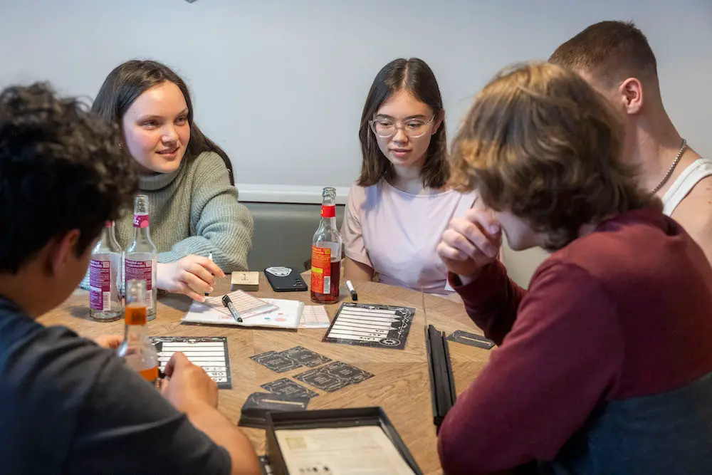 Young people playing a board game