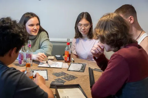 Young people playing a board game