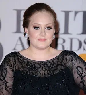 Adele begins 'basic' vocal training