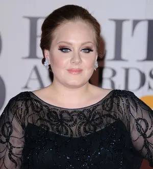 Adele begins 'basic' vocal training