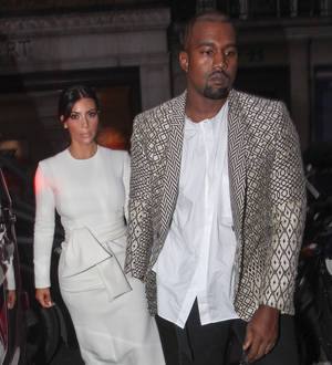 Kanye West and Kim Kardashian heckled after late fashion arrival