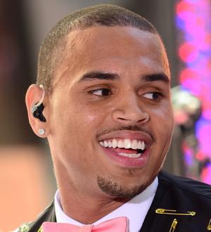Chris Brown laughs off stage slip