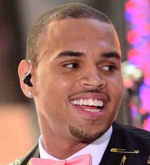 Chris Brown laughs off stage slip