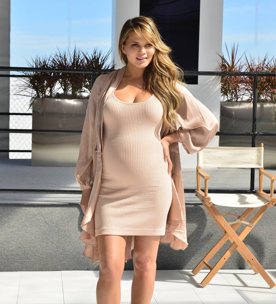 Chrissy Teigen having IVF jabs during SI shoot