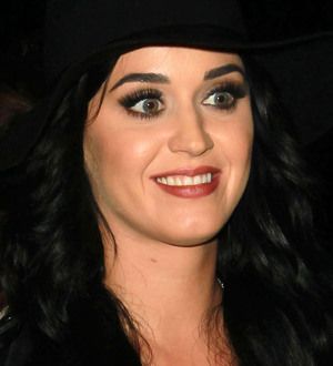Katy Perry donates signed guitar to amfAR auction