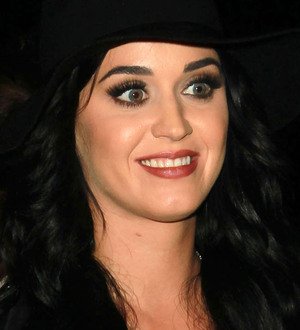 Katy Perry donates signed guitar to amfAR auction