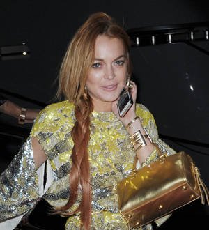Lindsay Lohan settles with clothing firm