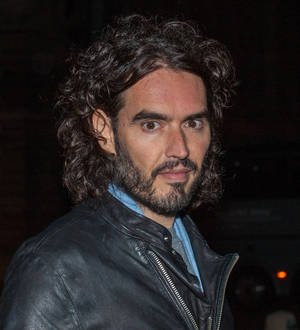 Russell Brand joins Million Mask March in London