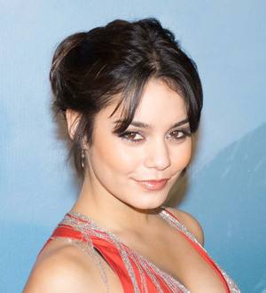 Vanessa Hudgens goes topless as bikini pops open on beach