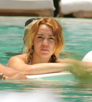 Miley Cyrus: 'Pool frolic with male pal was innocent'