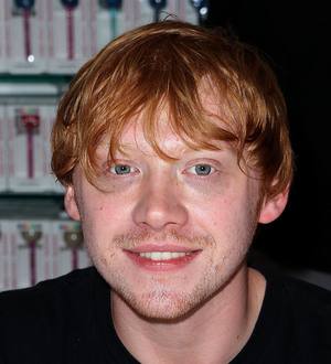 Rupert Grint hands out free Harry Potter DVDs