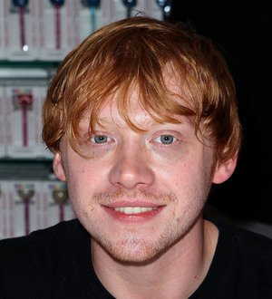 Rupert Grint hands out free Harry Potter DVDs