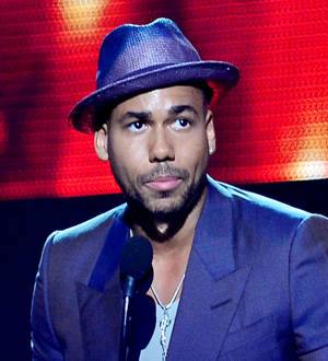 Singer Romeo Santos helped by Jordana Brewster on Furious 7 set