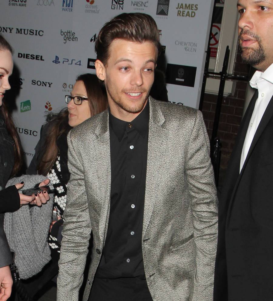 Louis Tomlinson 'is quickly learning to be a dad'