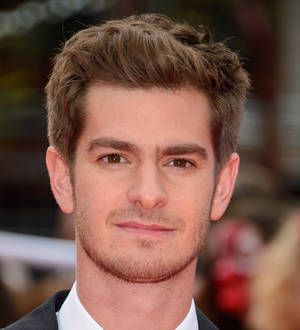 Andrew Garfield dons Spider-Man suit to visit children's charity