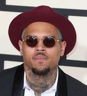 Chris Brown outs naked intruder with Instagram photo