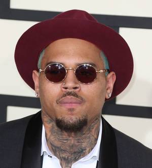 Chris Brown outs naked intruder with Instagram photo