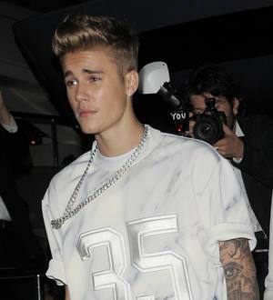 Justin Bieber escapes unharmed from paparazzo car chase crash