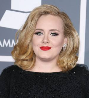 Adele snubs 'daunting' Glastonbury gig