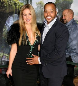Donald Faison celebrates hit new film with baby boy