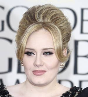 Adele's record-breaking Hello debuts at number one in Britain