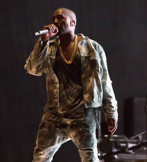 Kanye West plays Drake tracks as he covers for sick star