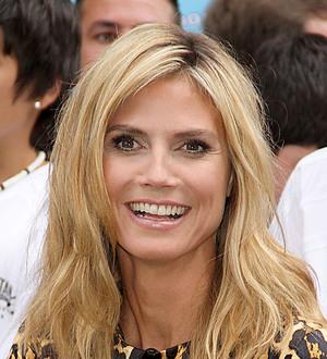 Heidi Klum goes topless to avoid tan lines at the beach