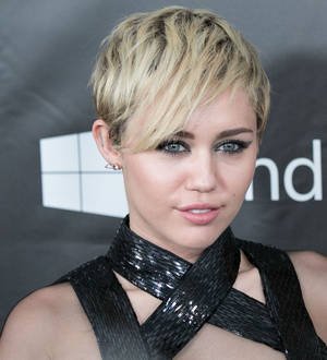 Miley Cyrus cheers on rumored boyfriend's college team
