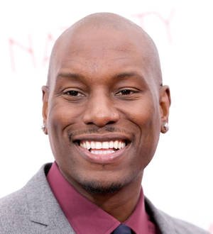 Tyrese Gibson smiling to pay tribute to late pal Walker