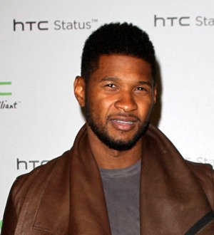 Usher proves death reports are false