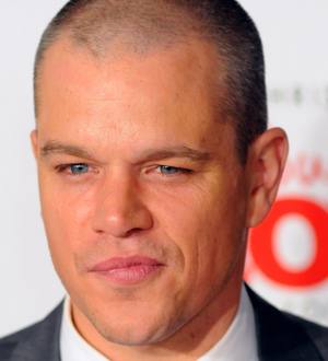 Matt Damon in a close-up shot, looking serious in a dark suit with a faint pinstripe