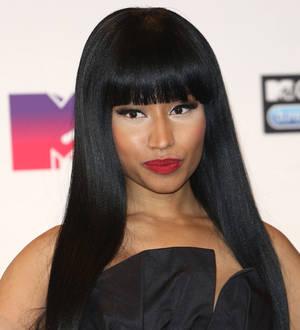 Nicki Minaj silences split rumors by promoting Meek Mill game