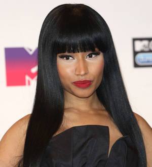 Nicki Minaj silences split rumors by promoting Meek Mill game