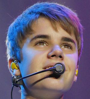 Justin Bieber brings hero schoolboy onstage