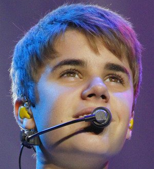 Justin Bieber brings hero schoolboy onstage