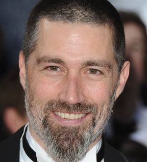 Matthew Fox with closely shaved head and a dark beard in a promotional image for the movie, Bone Tomahawk