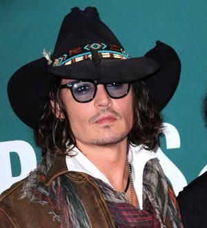 Johnny Depp takes up Alice Cooper's offer to play onstage