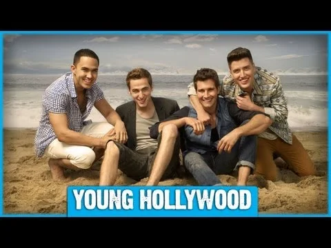 Big Time Rush members pose in a fan-submitted photo with band member Kendall Schmidt on an iPad