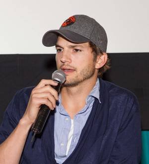 Ashton Kutcher is hoping to buy a beach house with Two and a Half Men co-star