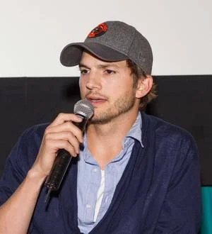 Ashton Kutcher is hoping to buy a beach house with Two and a Half Men co-star