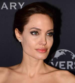 Angelina Jolie fights back tears at Unbroken premiere