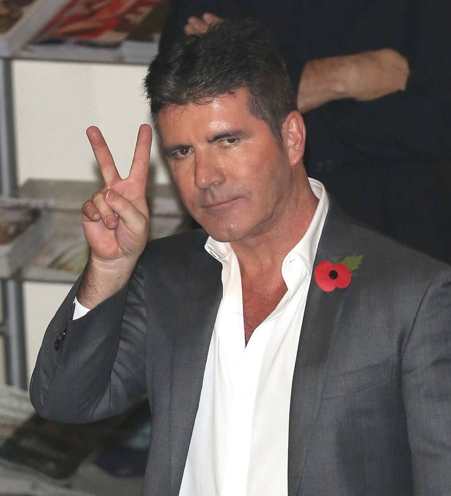 One Direction present mentor Simon Cowell with top music industry award