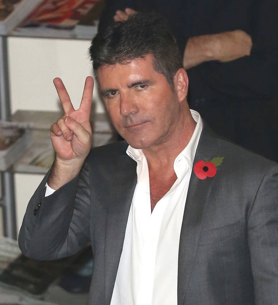 One Direction present mentor Simon Cowell with top music industry award