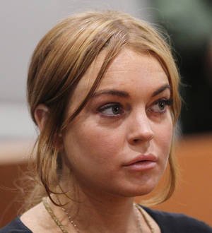 Lindsay Lohan's assault accuser threatens civil action