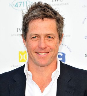 Hugh Grant's baby mother wins court injunction against paparazzi 'harassment'