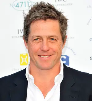 Hugh Grant's baby mother wins court injunction against paparazzi 'harassment'