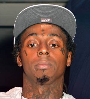 Lil Wayne to resolve huge tax bill