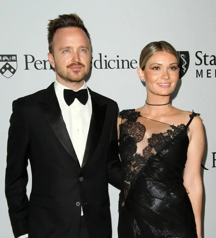 Aaron Paul stuns wife with Hong Kong airport surprise